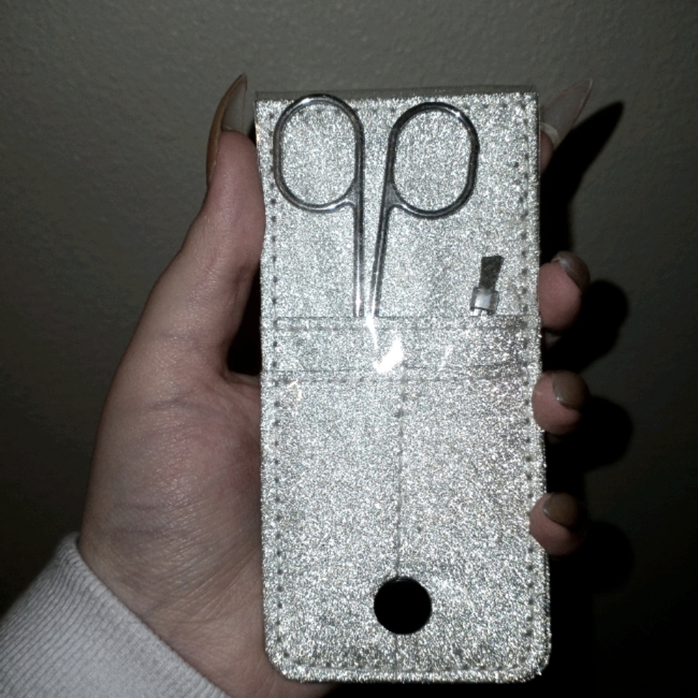 scissors and tweezers with silver packaging